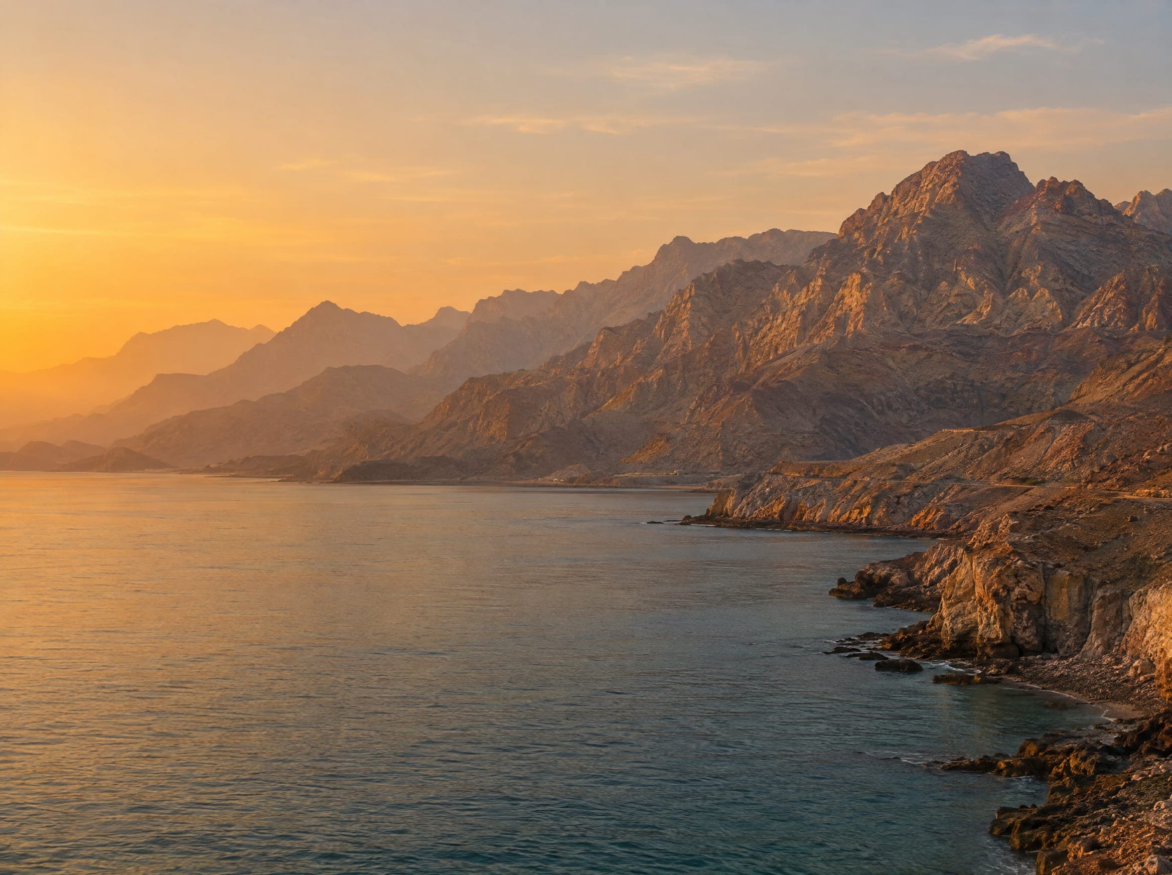 Mountains meeting the coast at golden hour